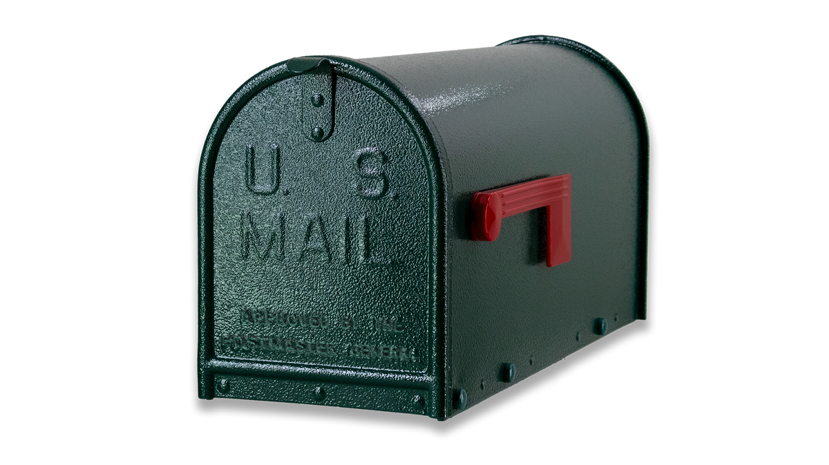 A Limited Edition : Textured Green Janzer Mailbox by Gaines Manufacturing Inc is showcased against a plain gray background, highlighting its premium, weather-resistant construction and elegant dark green textured finish. The sophisticated design incorporates a refined red flag and raised “U.S. Mail” lettering on the front, delivering both exceptional durability and upscale curb appeal ideal for discerning homeowners and prestigious HOAs.